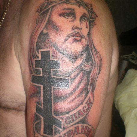 Тату в традиционном стиле на религиозную тему