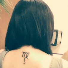 Татуировка на спине - знак зодиака