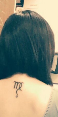 Татуировка на спине - знак зодиака