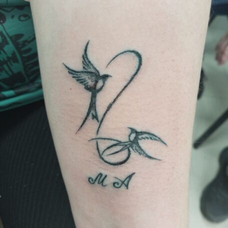 Татуировка две ласточки